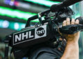 DALLAS, TX - FEBRUARY 09: A cameraman for the NHL on TNT shoots the action during the game between the Dallas Stars and the Nashville Predators on February 9, 2022 at the American Airlines Center in Dallas, Texas. (Photo by Matthew Pearce/Icon Sportswire)
