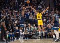Dec 13, 2024; Minneapolis, Minnesota, USA; Minnesota Timberwolves guard Anthony Edwards (5) makes a three point basket over the defense of Los Angeles Lakers guard Max Christie (12) in the first quarter at Target Center. Mandatory Credit: Matt Blewett-Imagn Images