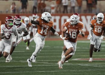 Nov 22, 2025; Austin, Texas, USA; Texas Longhorns linebacker Liona Lefau (18) runs for after recovering a fumble during the second half against the Arkansas Razorbacks at Darrell K Royal-Texas Memorial Stadium. Mandatory Credit: Scott Wachter-Imagn Images